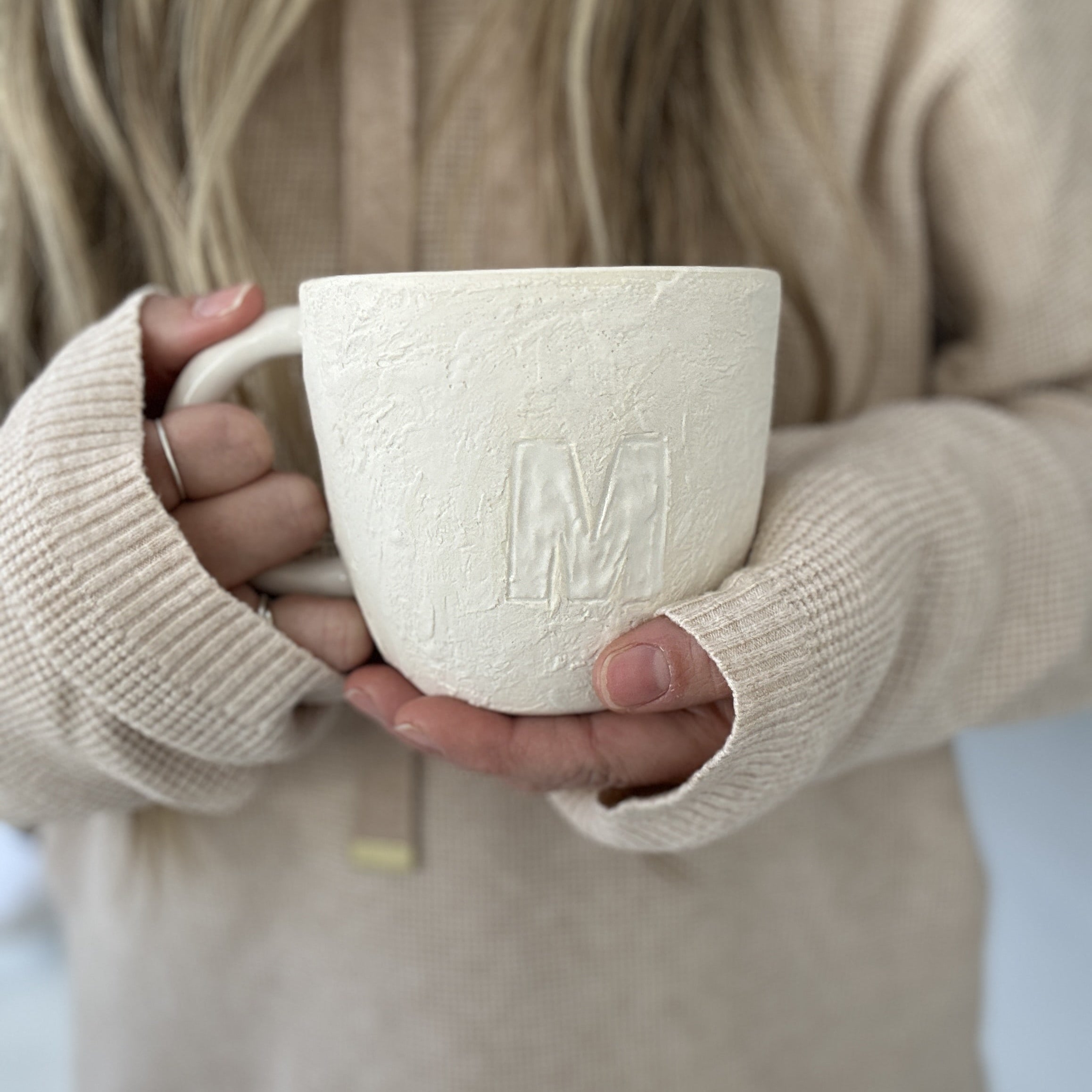Handmade ceramic mugs in neutral tones by Muddy Heart