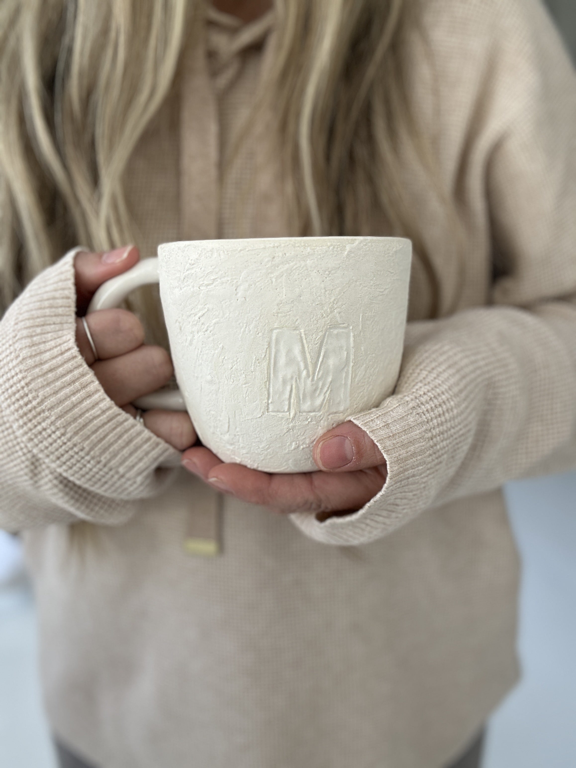 Handmade ceramic mugs in neutral tones by Muddy Heart