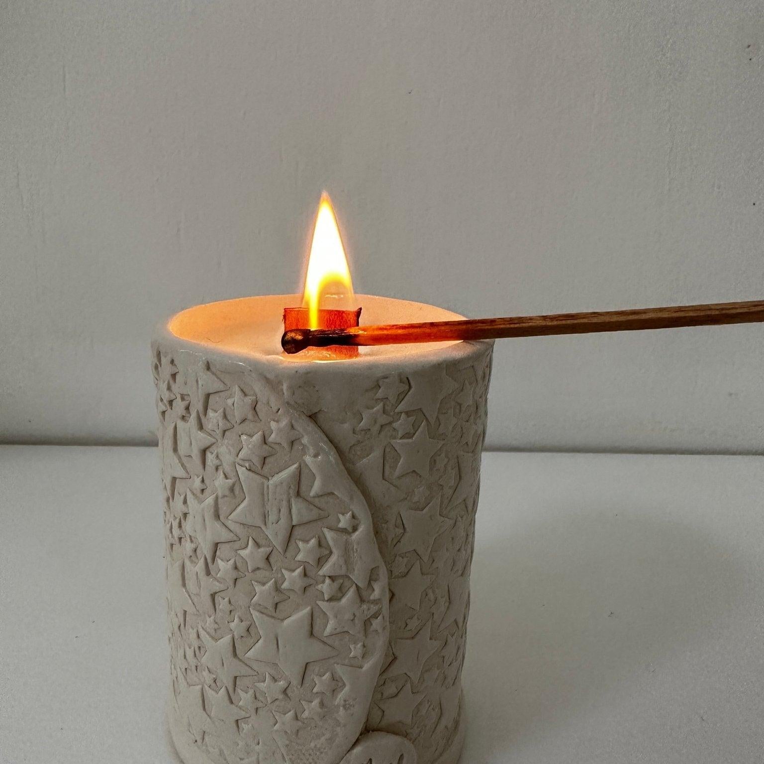 Hand-poured soy candles in handmade ceramic vessels by Muddy Heart