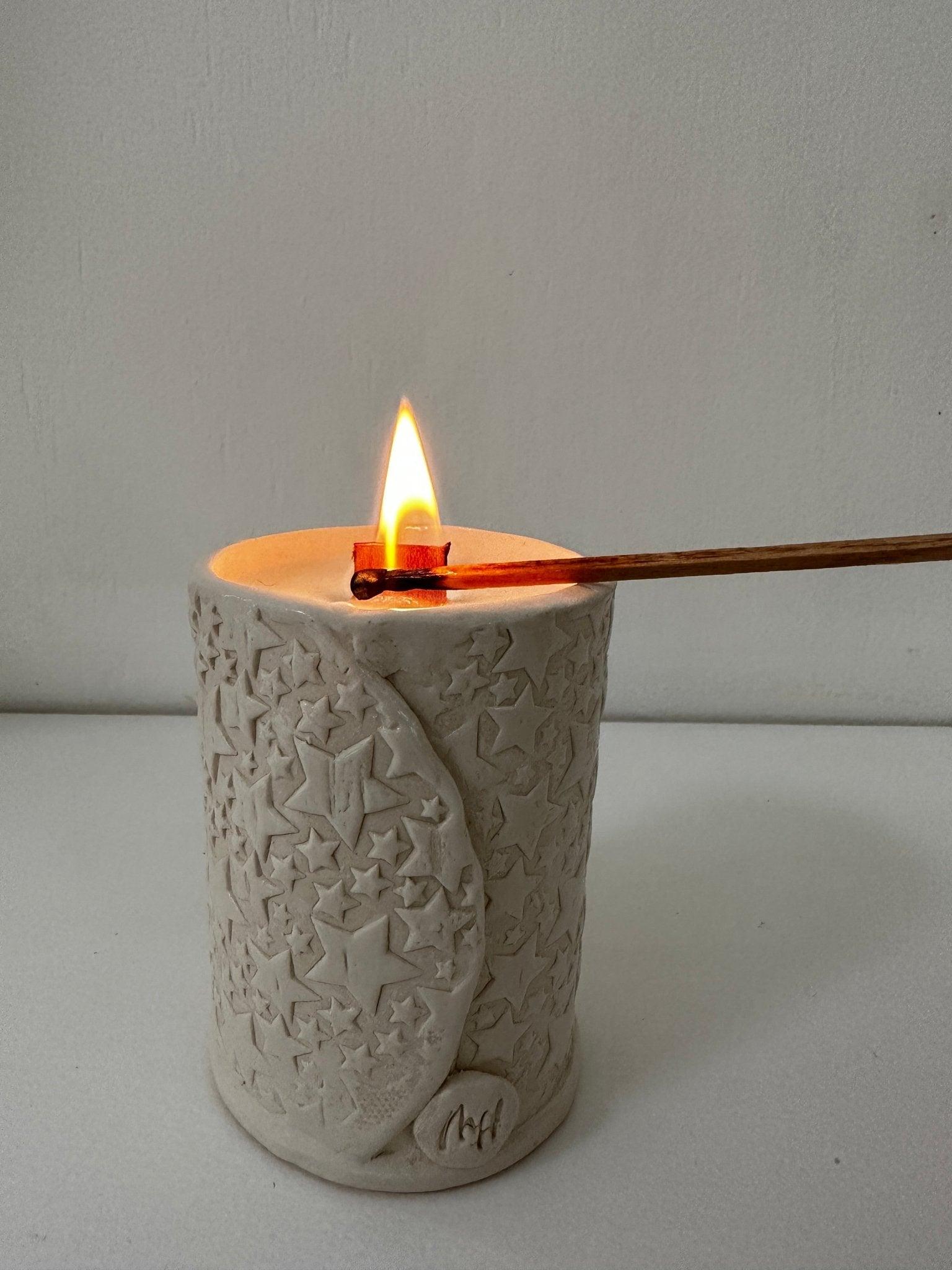 Hand-poured soy candles in handmade ceramic vessels by Muddy Heart