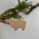 Personalized porcelain sheep ornament with a custom name, a handmade baby's first Christmas keepsake