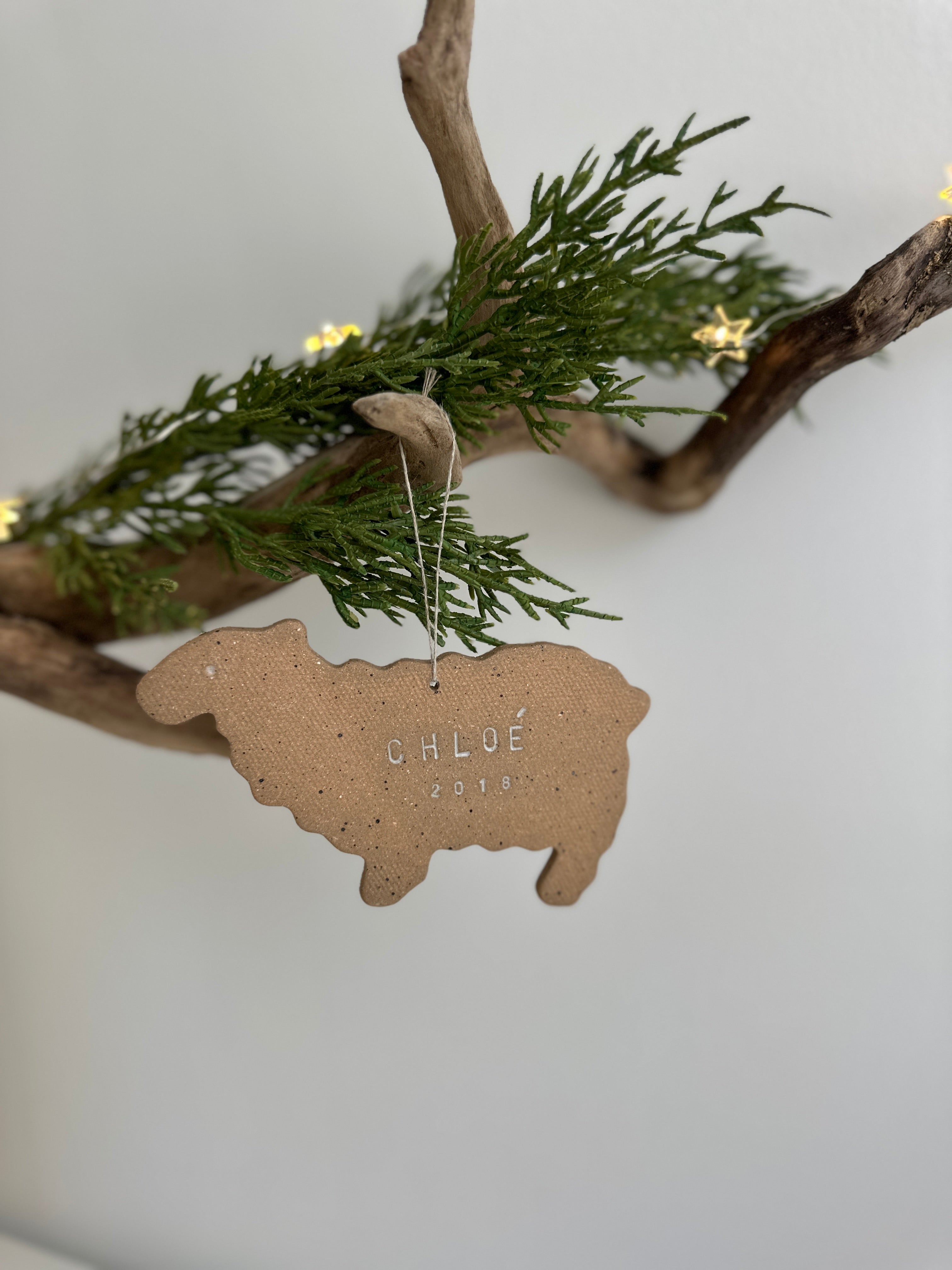 Personalized porcelain sheep ornament with a custom name, a handmade baby's first Christmas keepsake