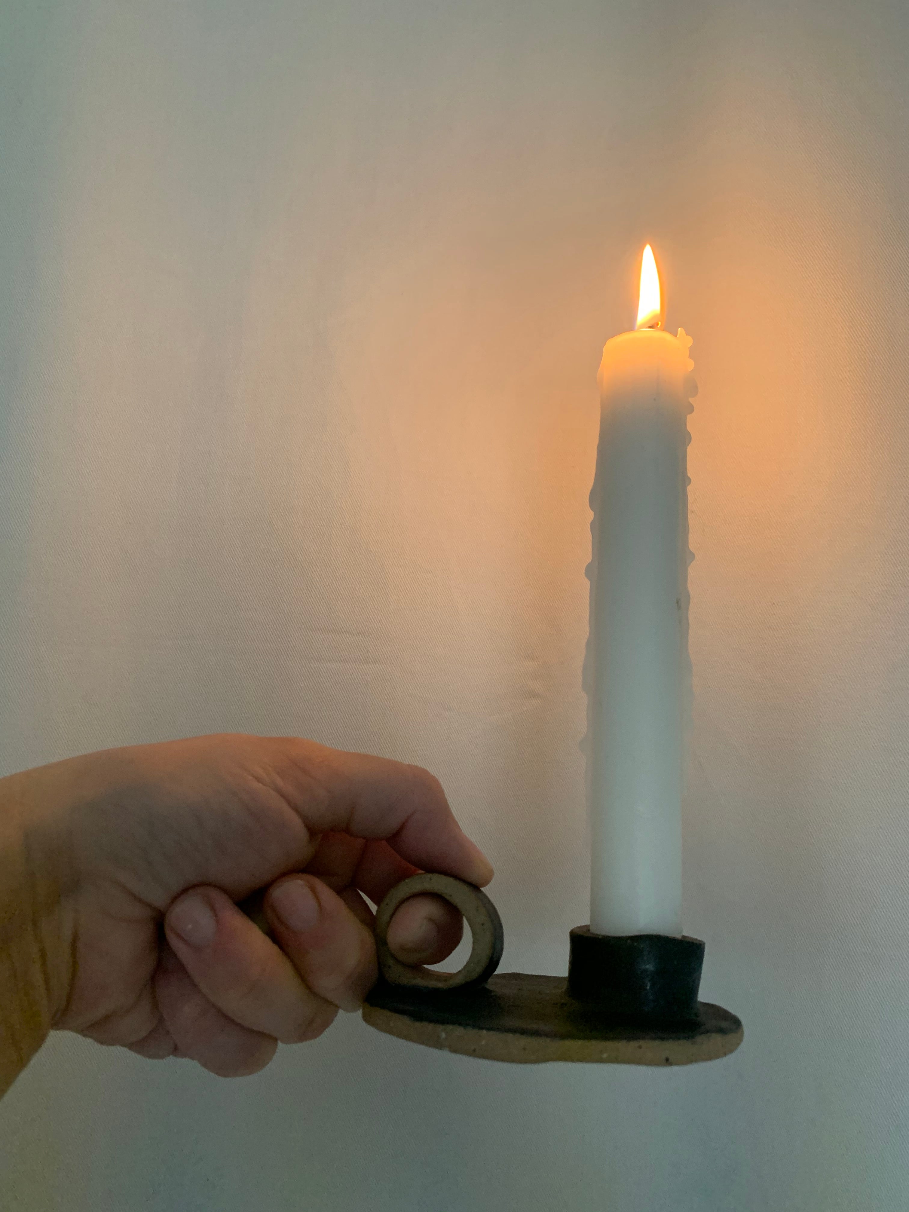 Handmade primitive ceramic taper candle holder in a neutral glaze
