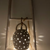 Handmade stoneware pendant lamp with hand-carved star cutouts