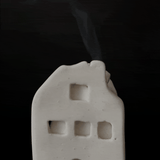Ceramic house-shaped incense cone burner with an interior dish