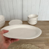 Ceramic fruit bowl with a smooth texture and raw edge