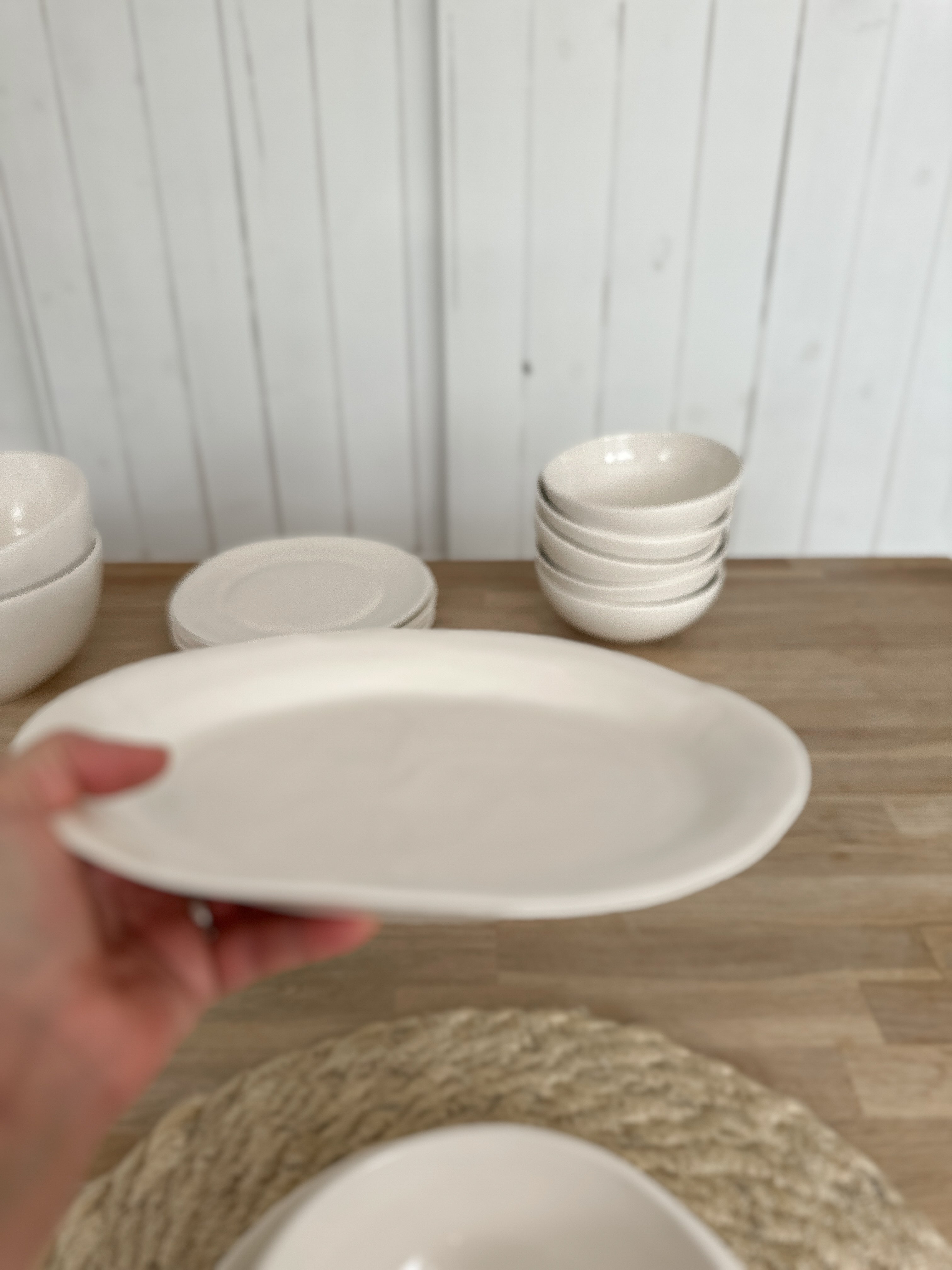 Ceramic fruit bowl with a smooth texture and raw edge