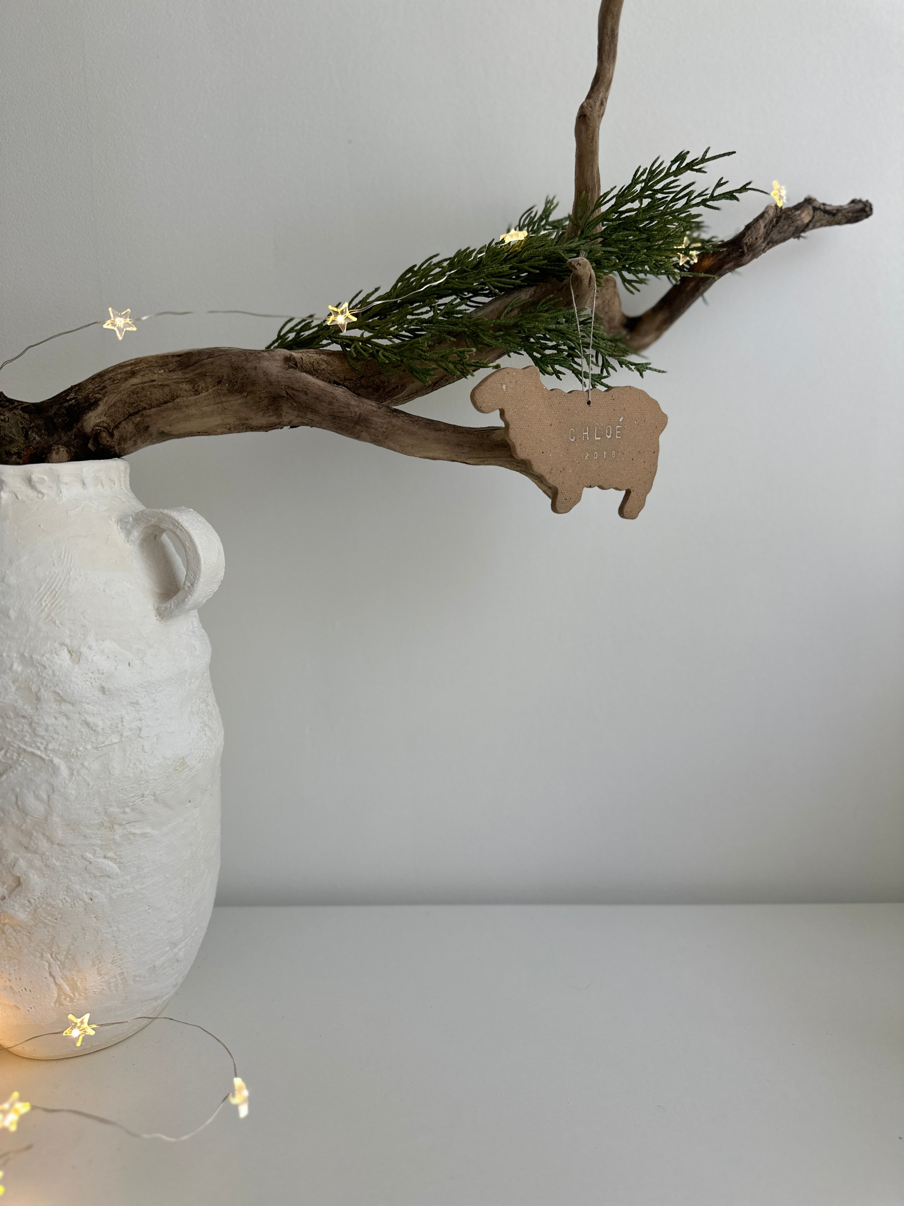 Personalized porcelain sheep ornament with a custom name, a handmade baby's first Christmas keepsake
