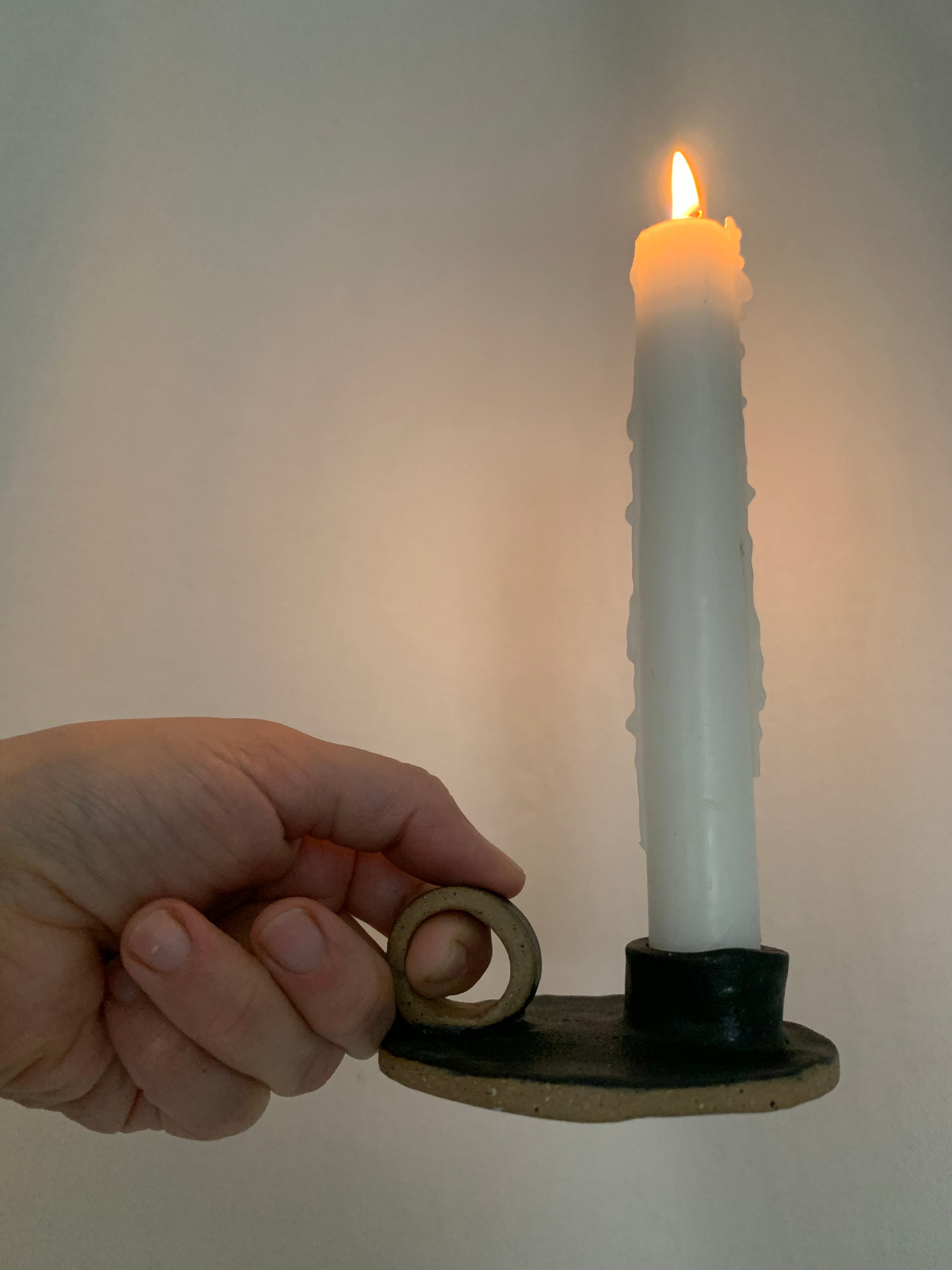 Handmade primitive ceramic taper candle holder in a neutral glaze