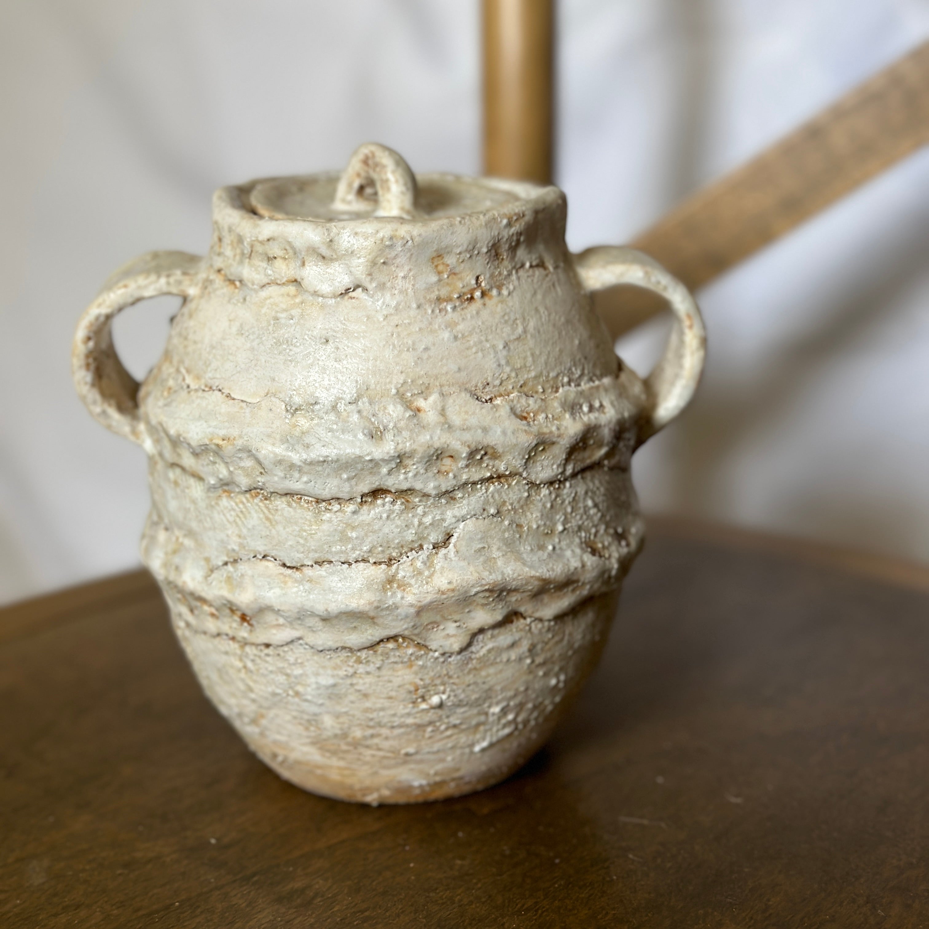 Handmade ceramic jar with lid in textured white glaze