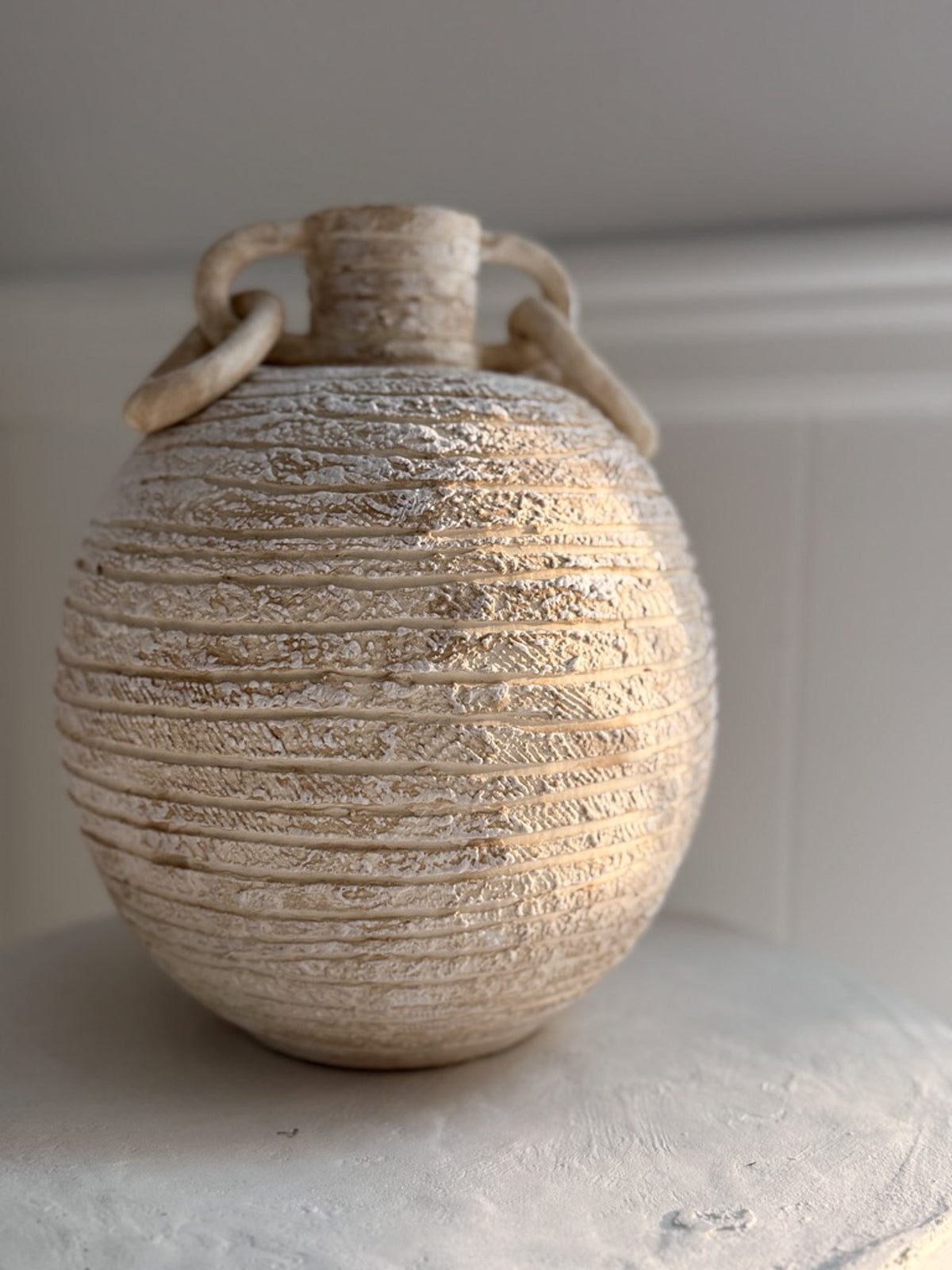 A large textured handmade ceramic pendant by Muddy Heart