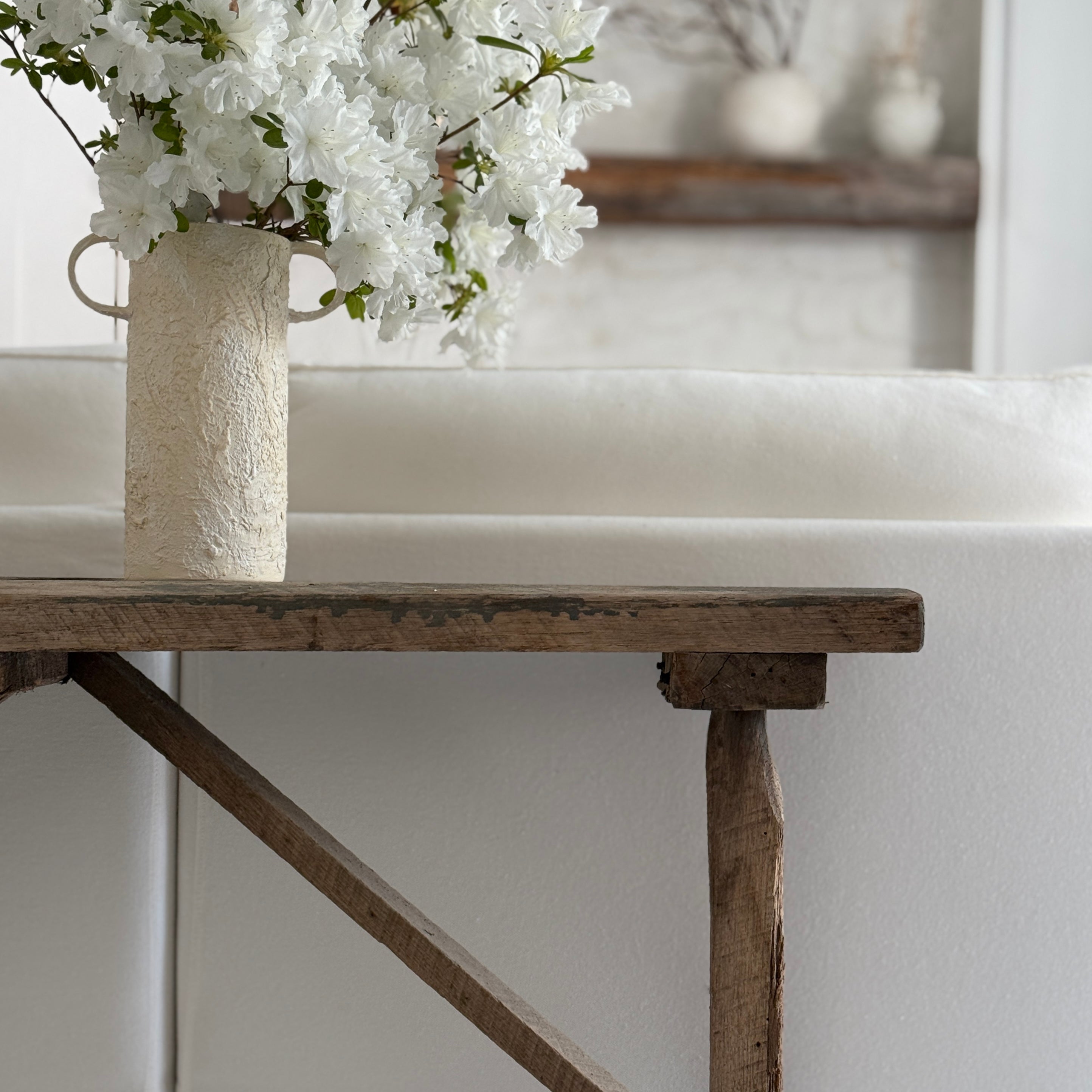 Handmade tall ceramic vessel with a handle for long-stemmed flowers