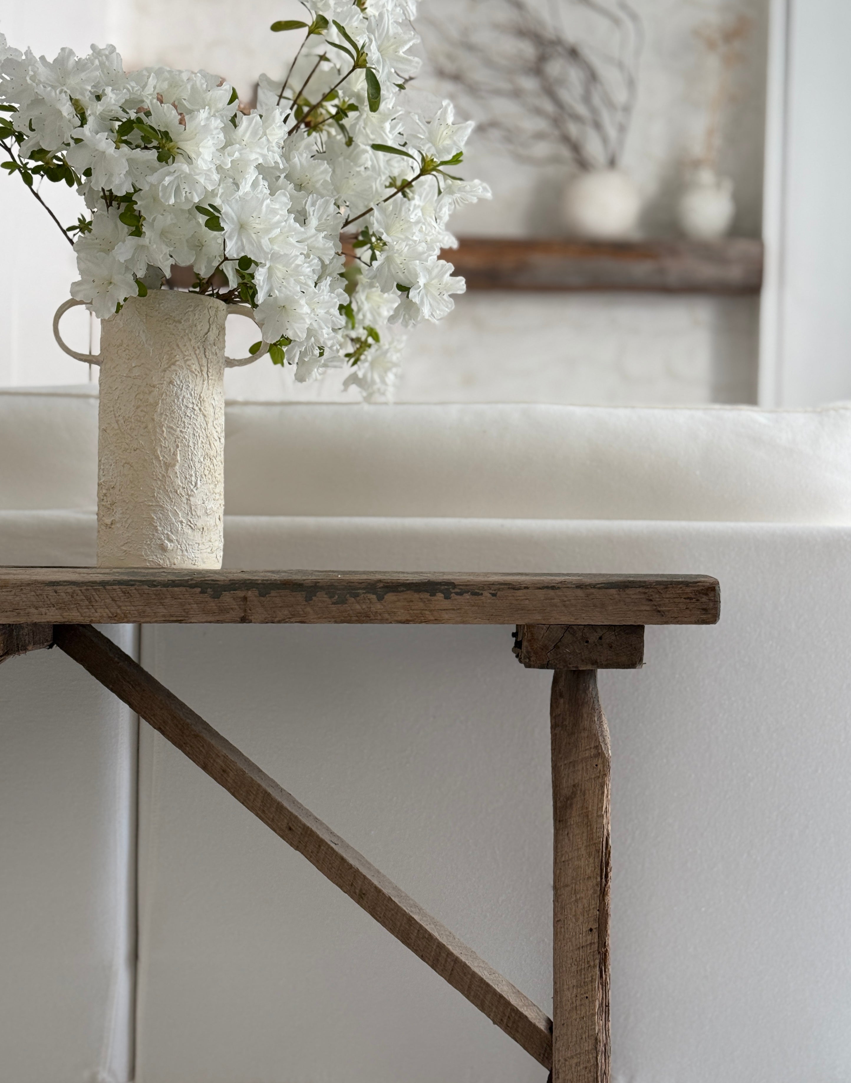 Handmade tall ceramic vessel with a handle for long-stemmed flowers