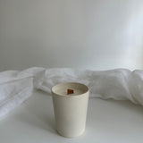 Reusable carved-star ceramic candle vessel in a neutral finish
