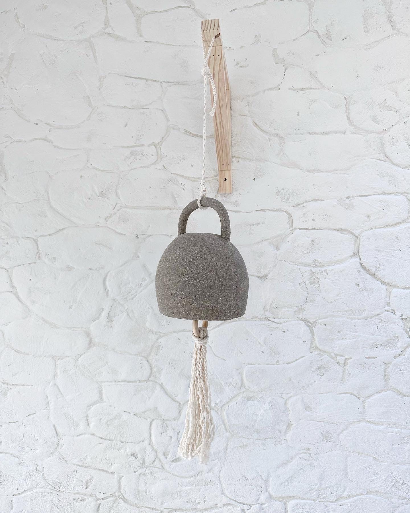 Handmade large curved ceramic bell with thick cotton rope