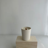 Handmade soy candle in a stoneware tumbler with star detailing