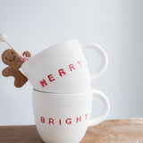 Handmade ceramic holiday mug lettered Merry and Bright in a neutral glaze