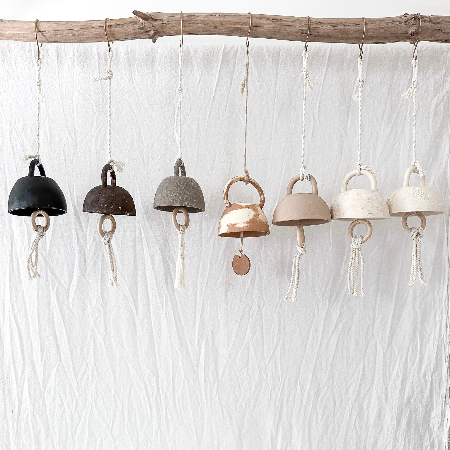 Small handmade ceramic bell in a neutral glaze, seconds sale