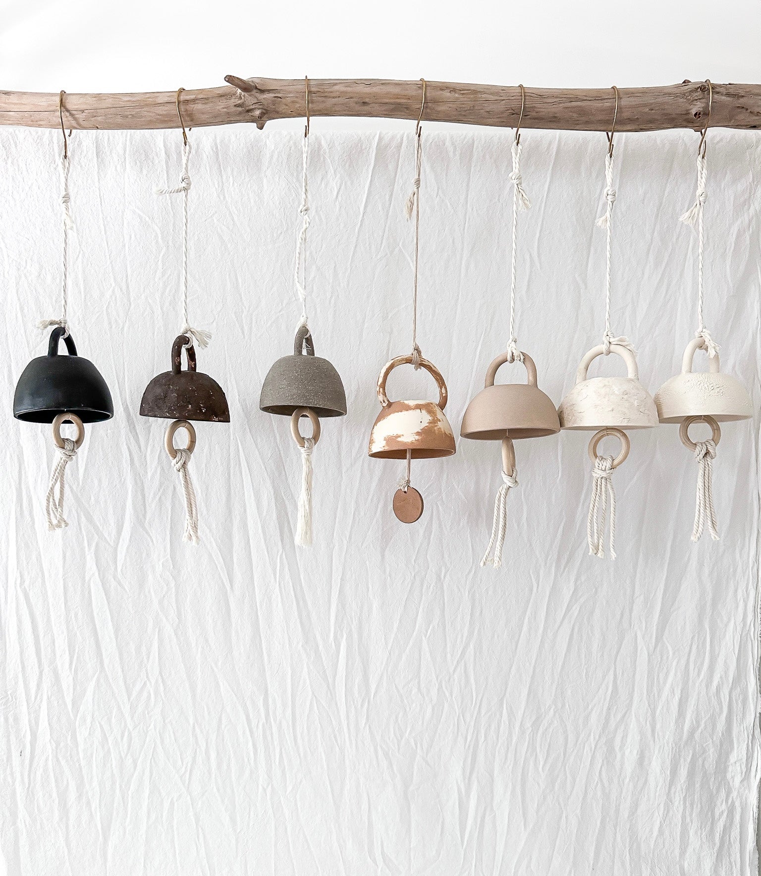 Small handmade ceramic bell in a neutral glaze, seconds sale