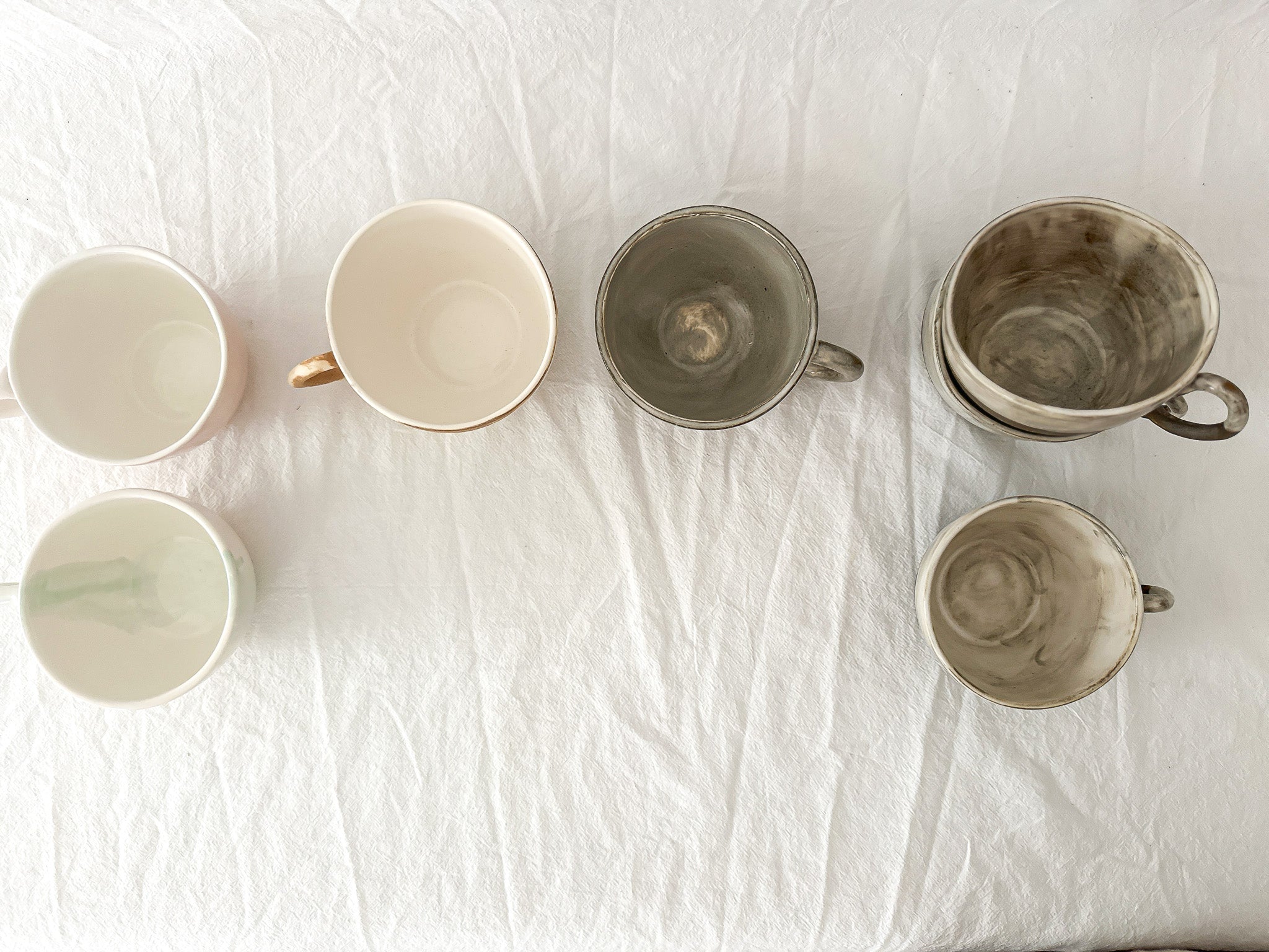 Handmade ceramic mug with a warm neutral glaze, seconds sale
