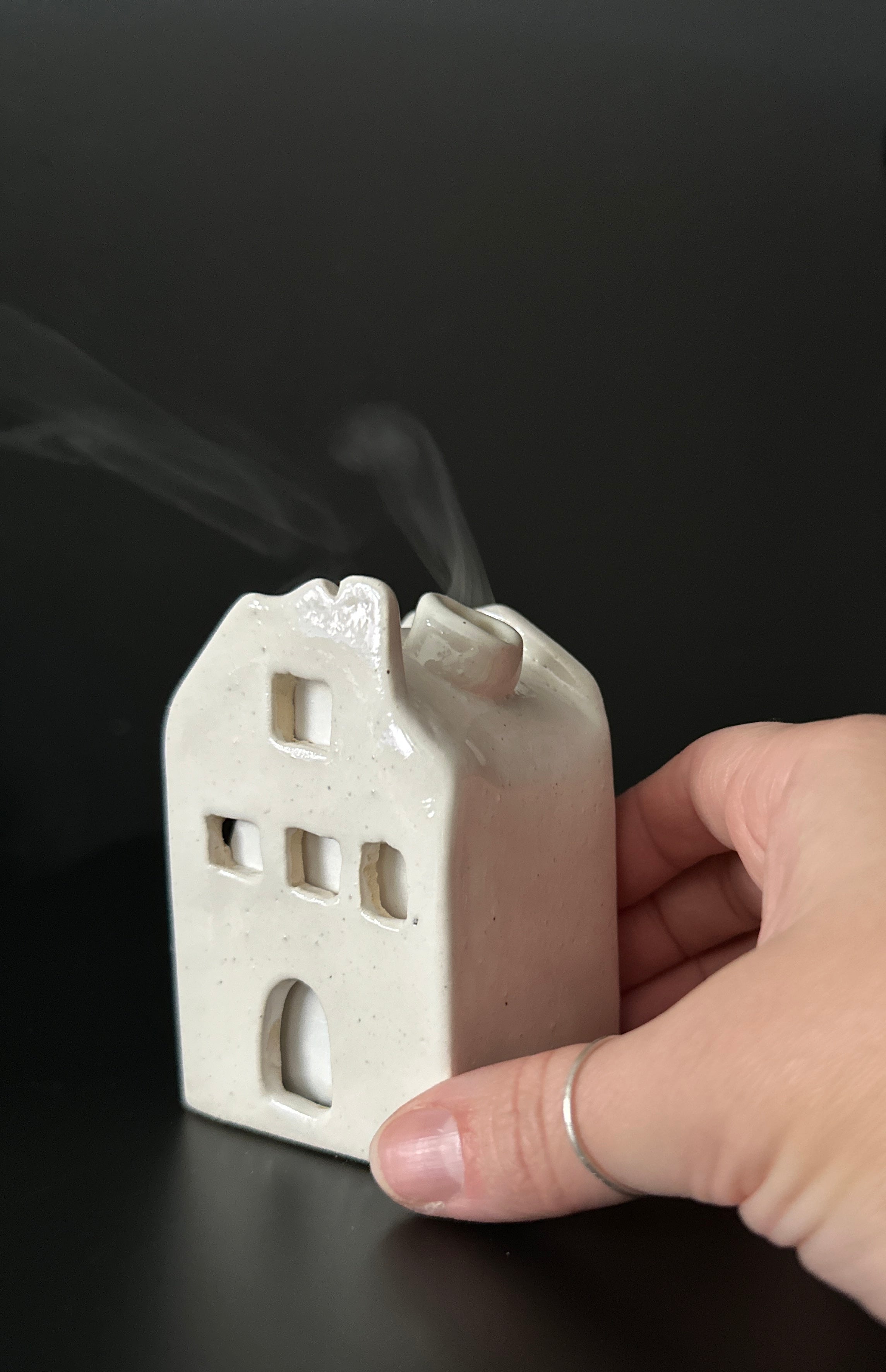 Ceramic house-shaped incense burner in a neutral glaze