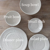 Handmade lace-textured white stoneware dinnerware set
