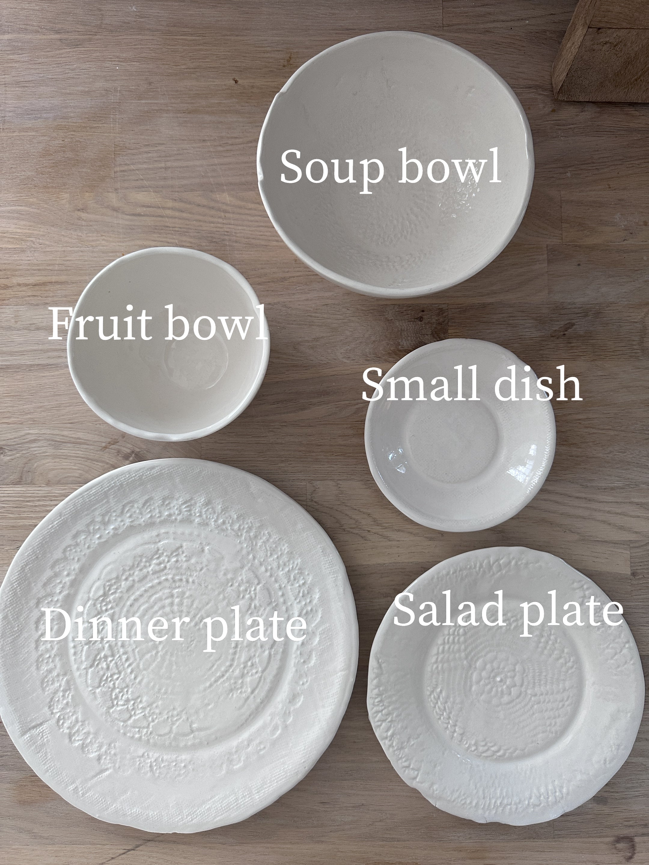 Handmade lace-textured white stoneware dinnerware set