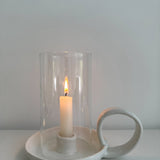 Looped ceramic hurricane candle holder in a neutral finish
