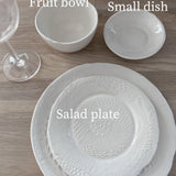 Smooth-textured ceramic salad plate with an organic raw edge