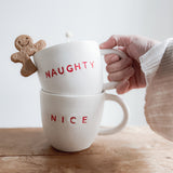 Handmade ceramic holiday mug lettered Naughty and Nice in a neutral glaze