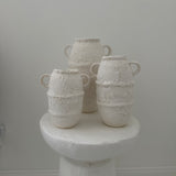 Artisan-crafted ceramic vases with a textured surface