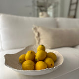 Handmade large ceramic serving bowl with a floral lace texture and glossy white glaze