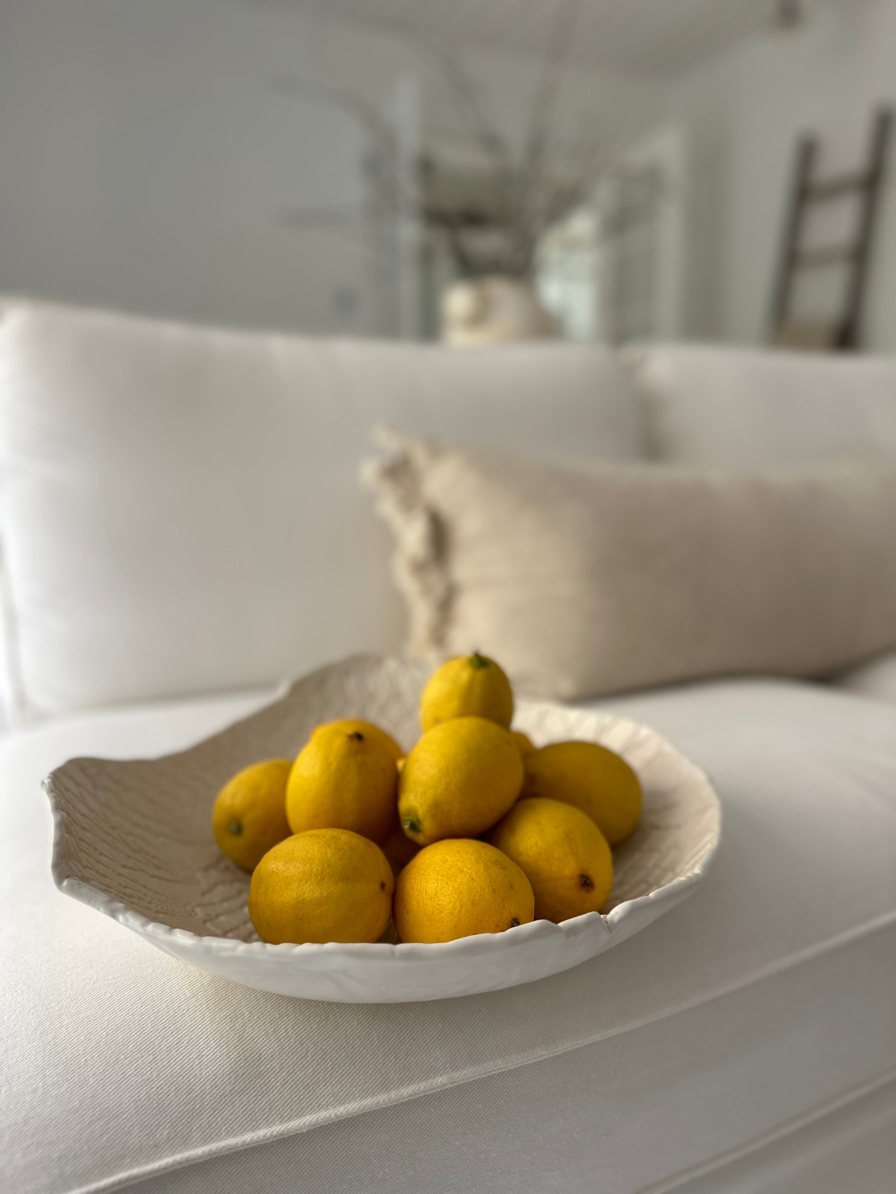 Handmade large ceramic serving bowl with a floral lace texture and glossy white glaze