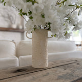 Handmade tall ceramic vessel with a handle for long-stemmed flowers