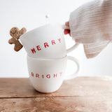 Handmade ceramic holiday mug lettered Merry and Bright in a neutral glaze