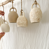 Detail of a handmade ceramic bell pendant lamp