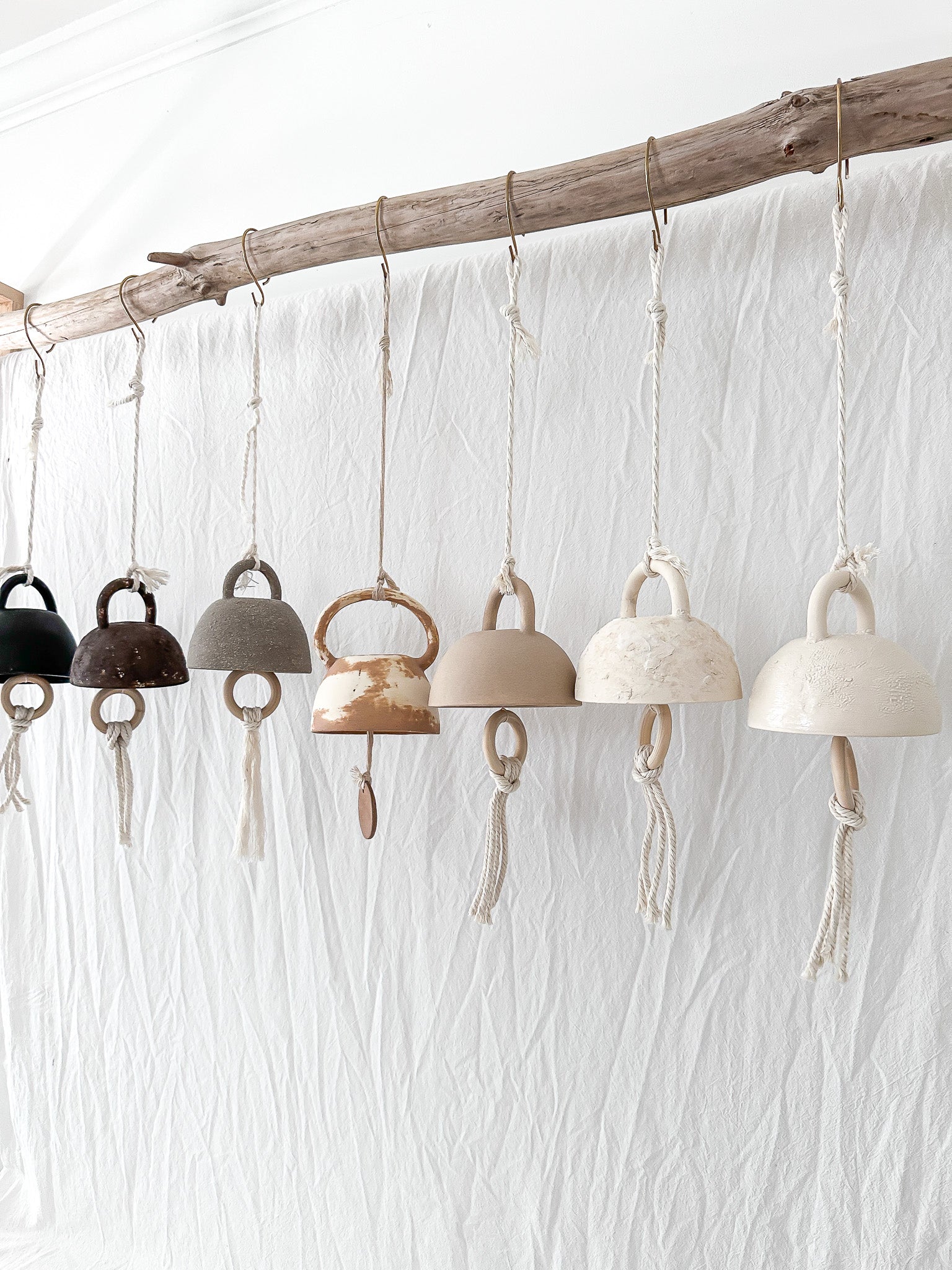 Small ceramic bell in a soft neutral finish, seconds sale