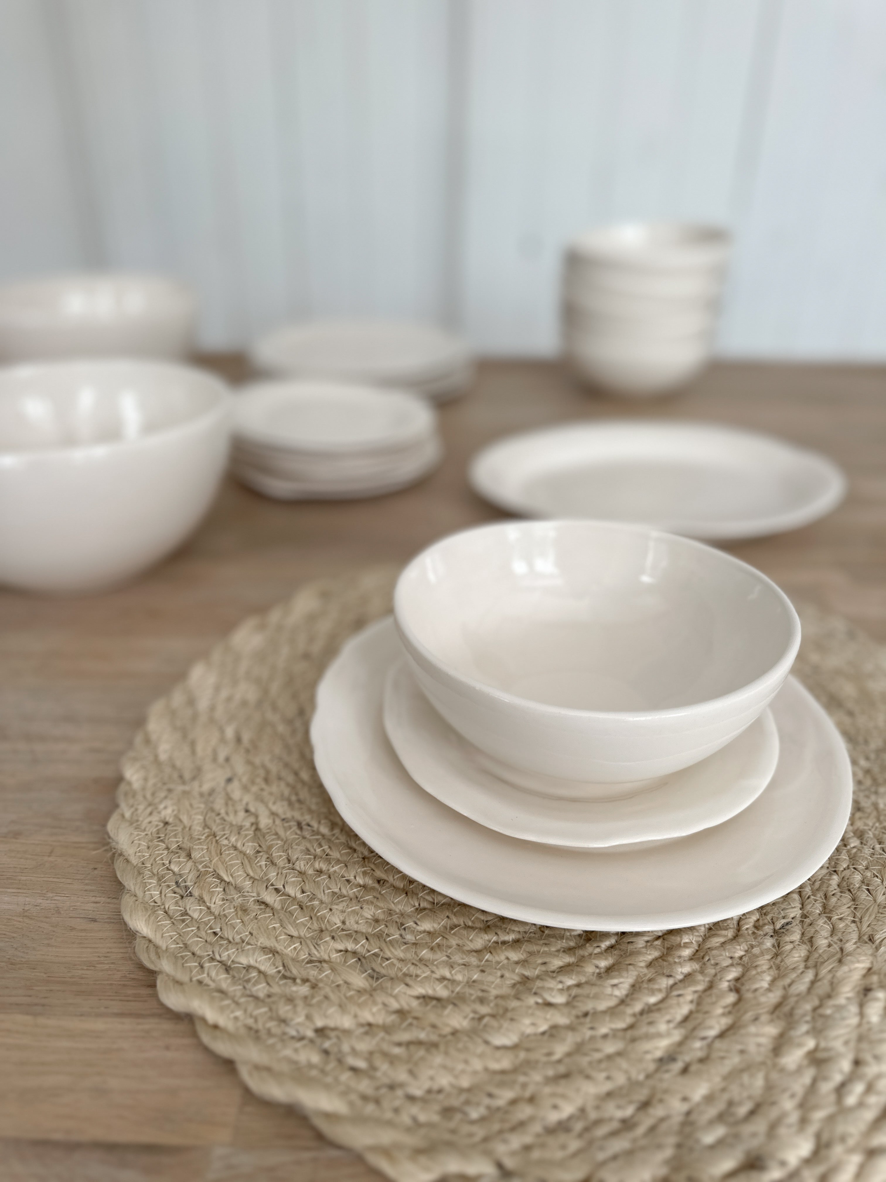 Handmade rustic-edge stoneware dinnerware in neutral tones