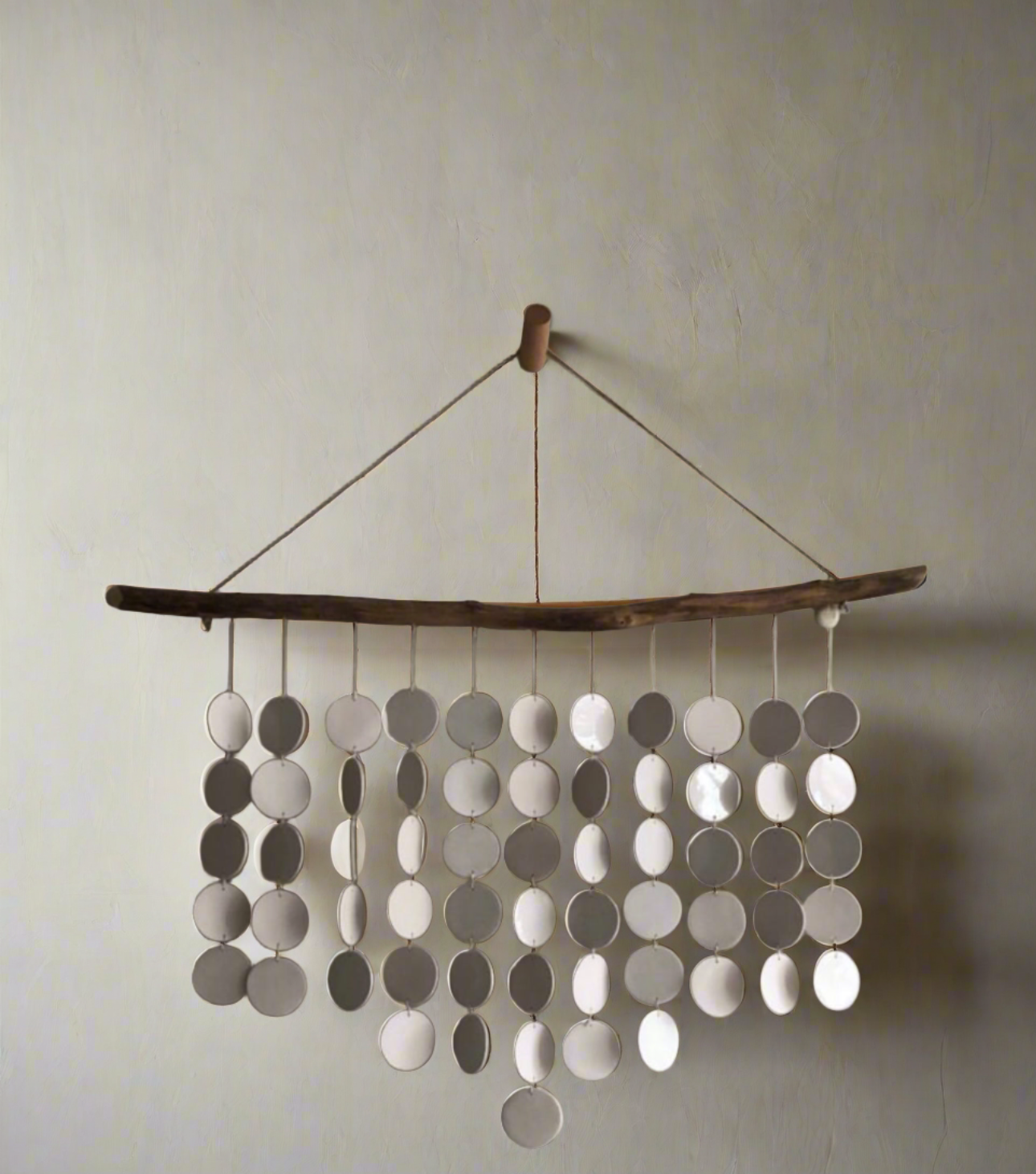 Eco-friendly wall art, driftwood and ceramic discs, modern coastal decoration