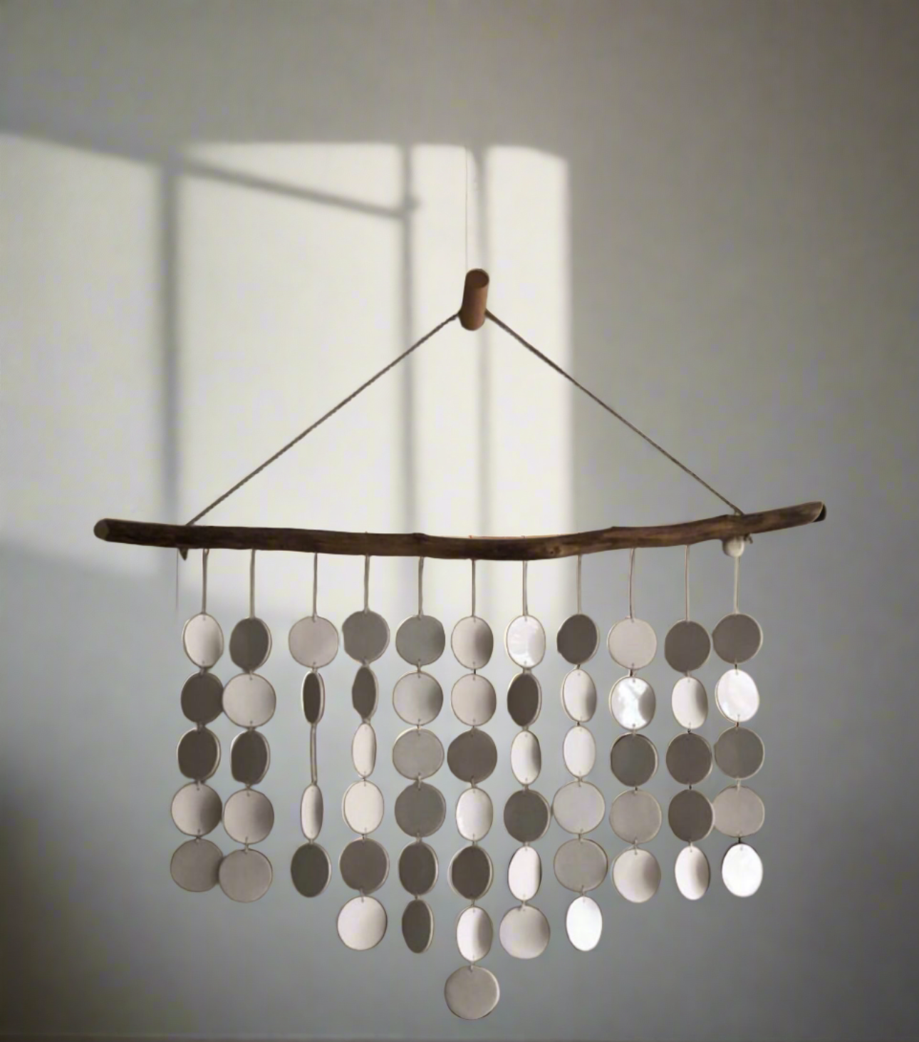 Handcrafted wall hanging, ceramic discs, driftwood, bohemian wall art