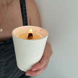 Hand-poured soy candle in a carved-star stoneware tumbler vessel
