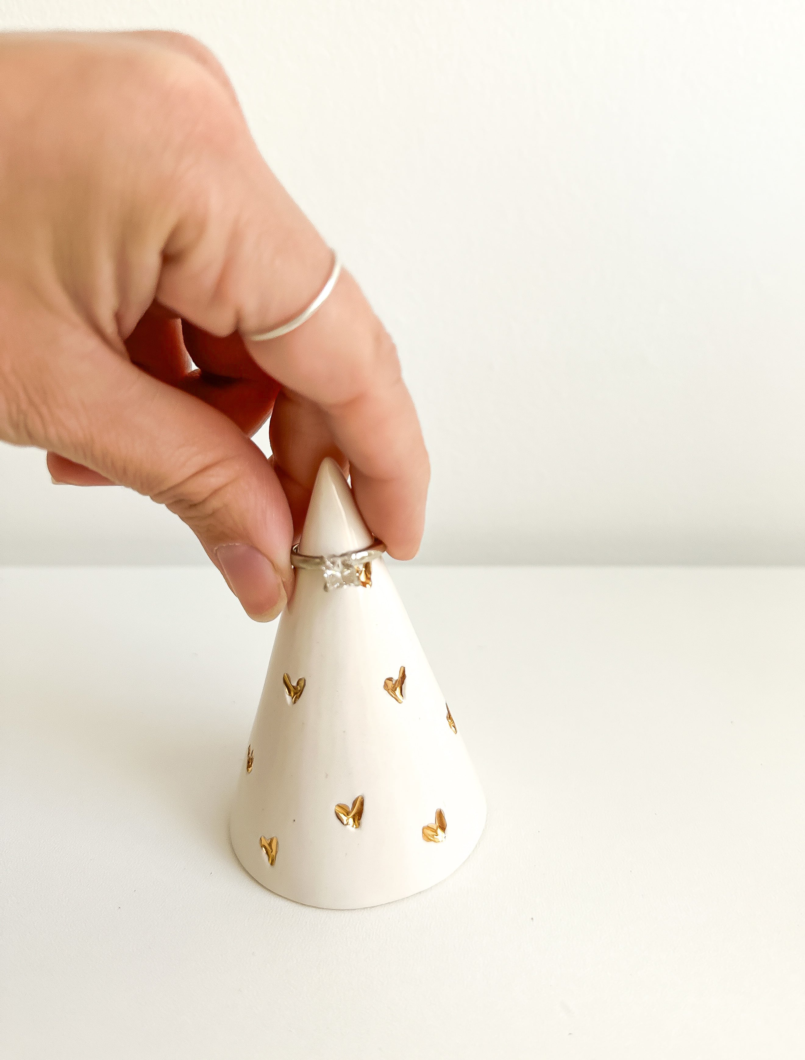Handmade ceramic ring cone carved with little hearts and gilded in real 22-karat gold
