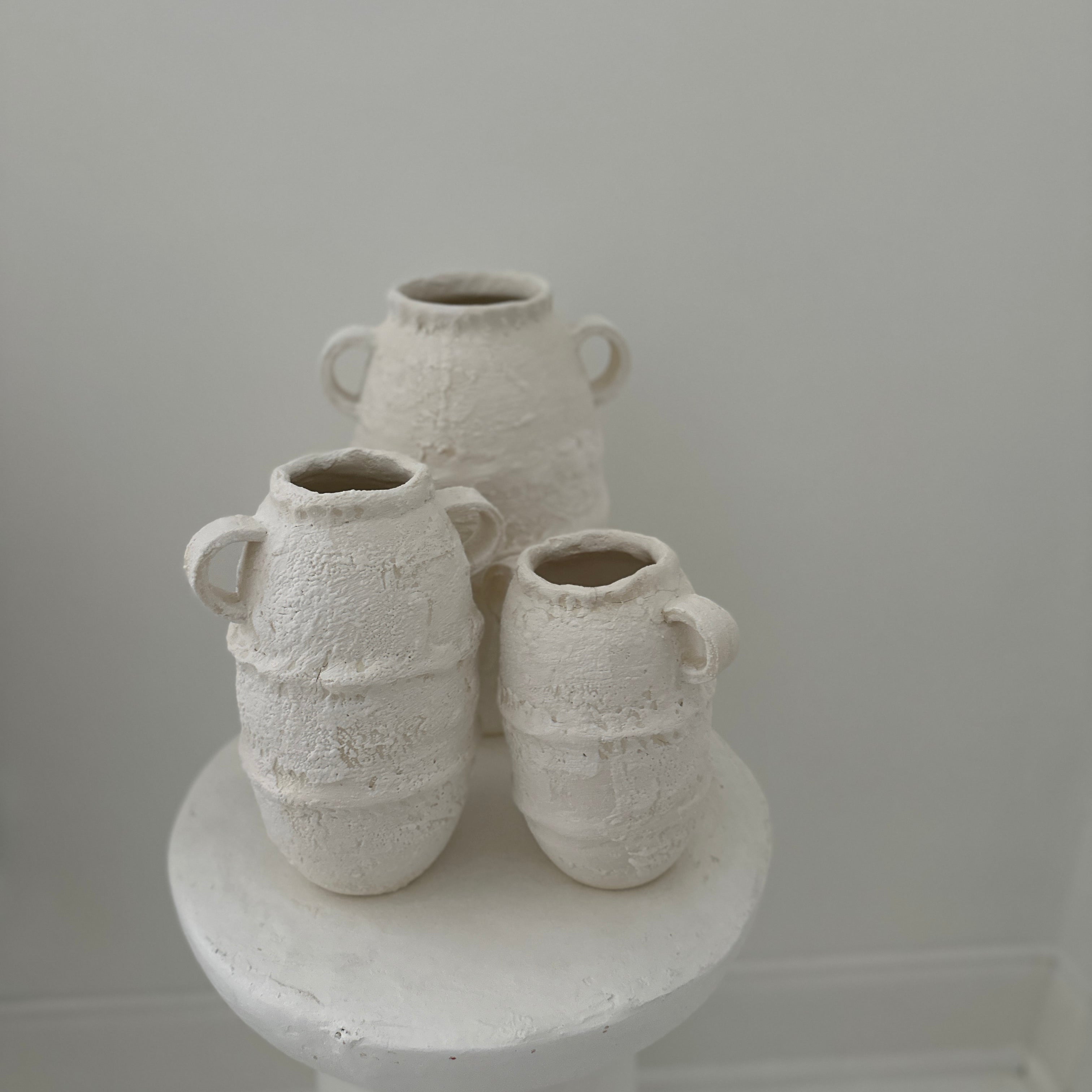 White Handmade ancient amphora style vessels  textured ceramic vases in neutral tones