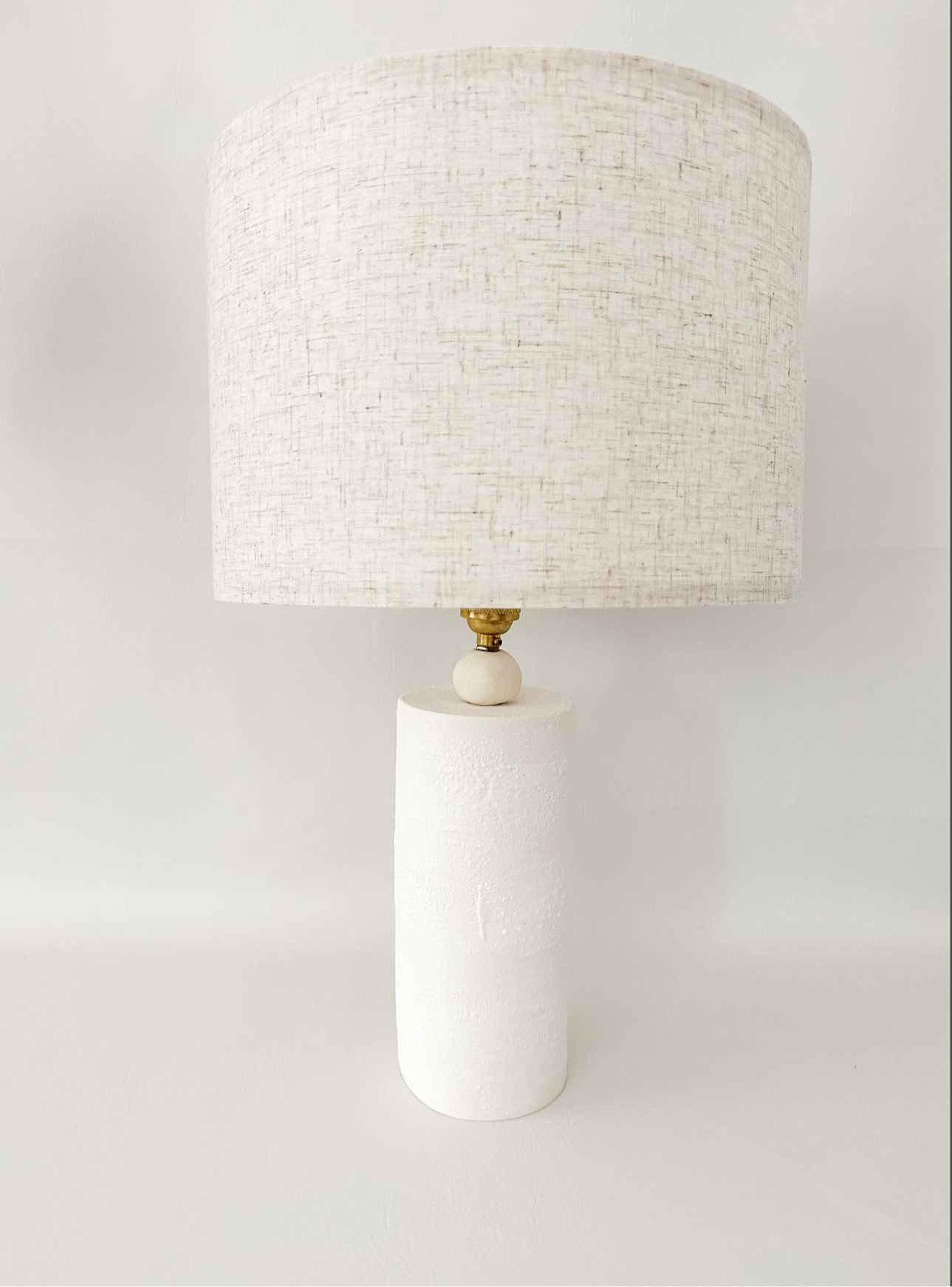 Wilma ceramic table lamp styled on a bedside table