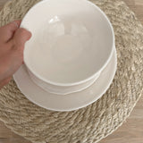Handmade white stoneware dinnerware set with rustic raw edges