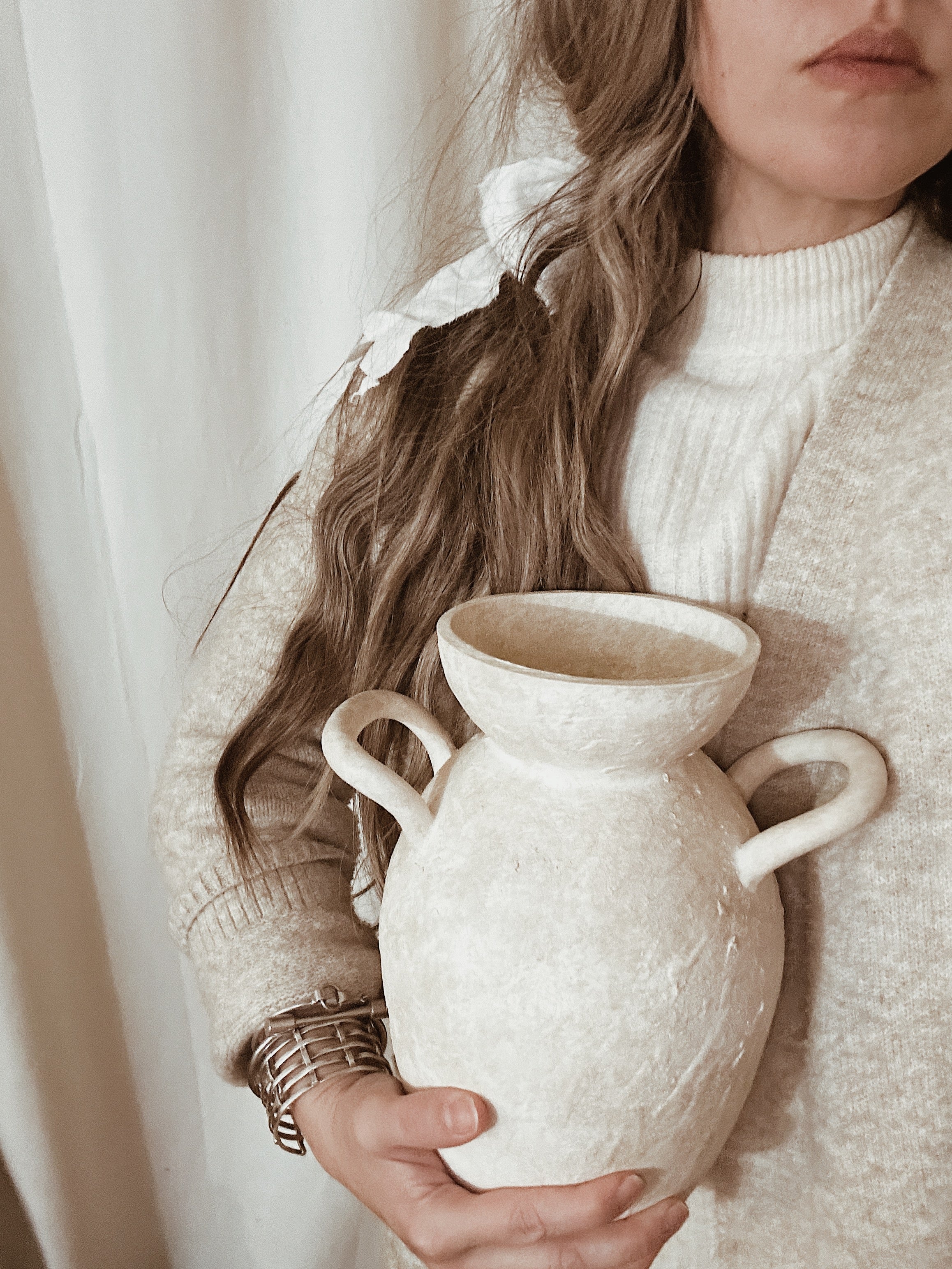 Handmade ceramic vase with handles and antique-inspired unearthed texture
