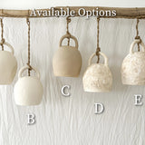 Handmade ceramic bell pendant lamp in a neutral glaze