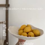 Handmade large ceramic serving bowl with a floral lace texture and glossy white glaze