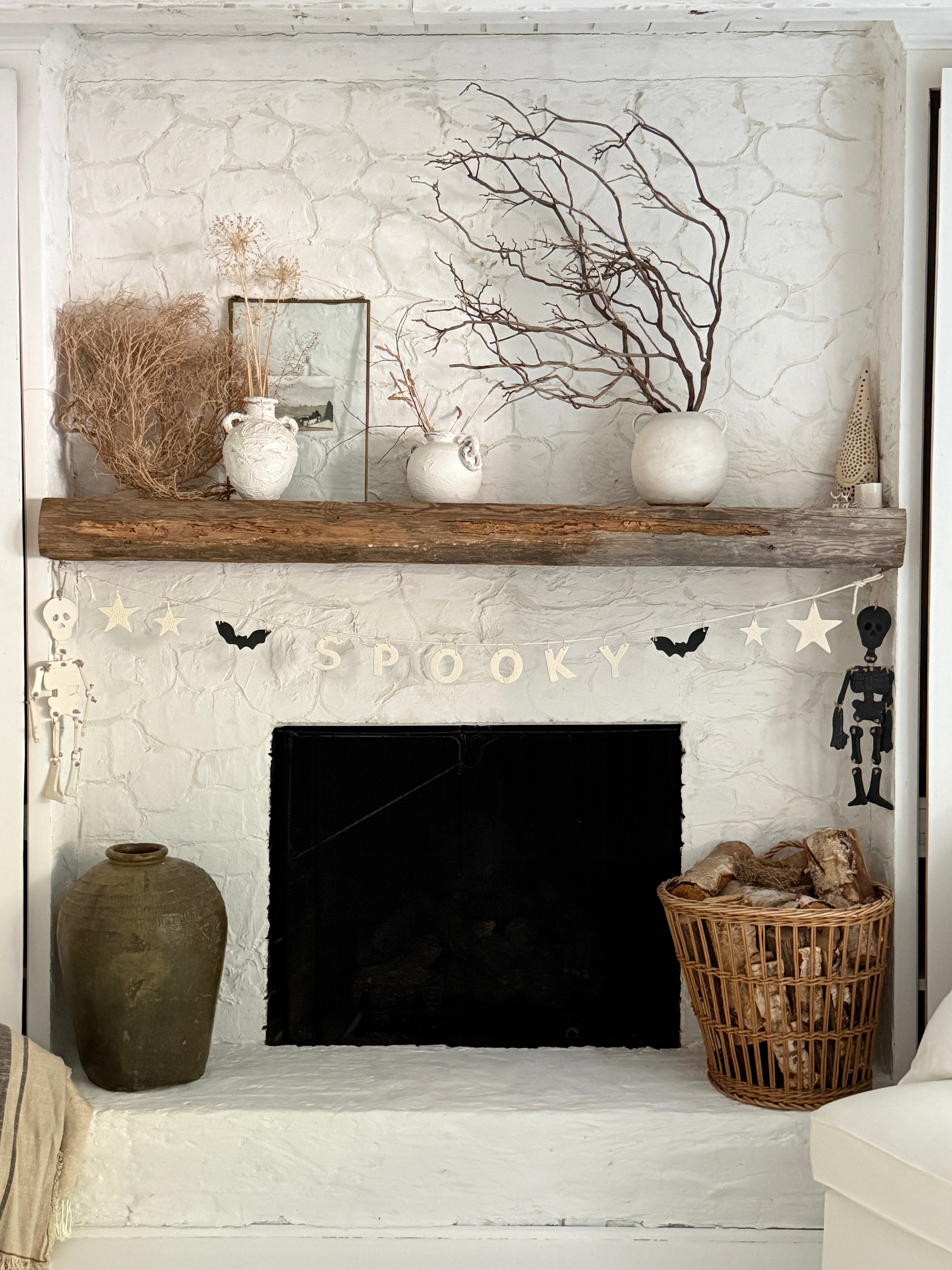 Handmade stoneware Halloween garland spelling SPOOKY on natural cotton rope in neutral tones.