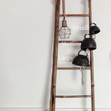 Handmade ceramic bell chime with wooden clapper in a neutral finish
